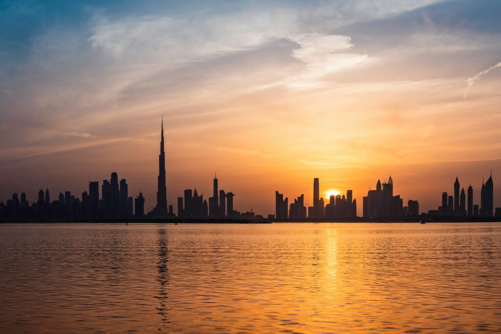 pexels photo 2115367 2115367 Enchanting view of Dubai's skyscrapers at sunset with the iconic Burj Khalifa outlined against the vivid sky.
